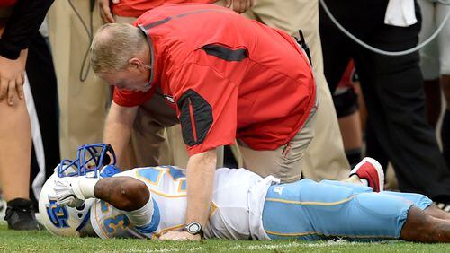 Georgia’s senior kicker Marshall Morgan was covering a kickoff when he collided with Southern player Devon Gales (33). Gales suffered a spinal injury and was unable to walk, at least for now.