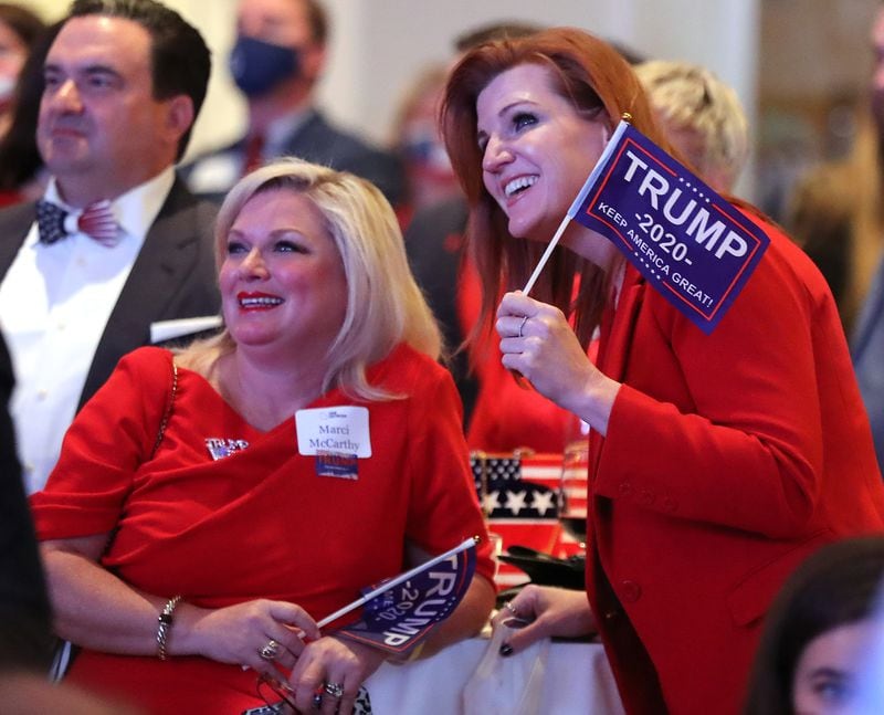 110320 Atlanta: Kirsten Davies, right, and Marci McCarthy react while watching returns for Georgia coming in at the Georgia Republican Party Election Night Celebration in the Intercontinental Buckhead Atlanta hotel on Tuesday, Nov 3, 2020 in Atlanta.   “Curtis Compton / Curtis.Compton@ajc.com”