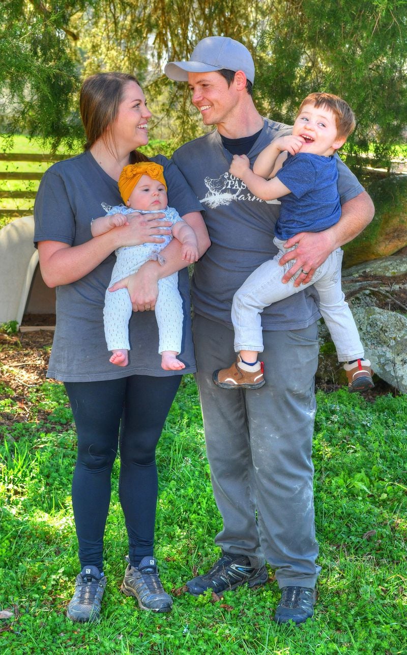 Grateful Pastures owners Sabrina Terry and Shaun Terry take a breather with their 3-year-old son, Jackson, and infant daughter, Lilah. Chris Hunt for The Atlanta Journal-Constitution