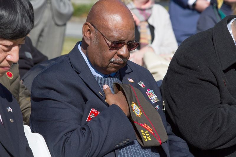 Charles A. Dobbins lowers his head throughout the invocation during the 2018 Veterans Day Commemoration at the Atlanta History Center on Sunday, November 11, 2018.  (Photo; STEVE SCHAEFER / SPECIAL TO THE AJC)
