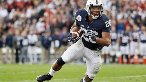 Penn State Nittany Lions running back Saquon Barkley (26) looks for room to run against the USC Trojans during the first half of the Rose Bowl NCAA college football game, Monday, Jan. 2, 2017 in Pasadena, Calif. (AP Photo/Doug Benc)