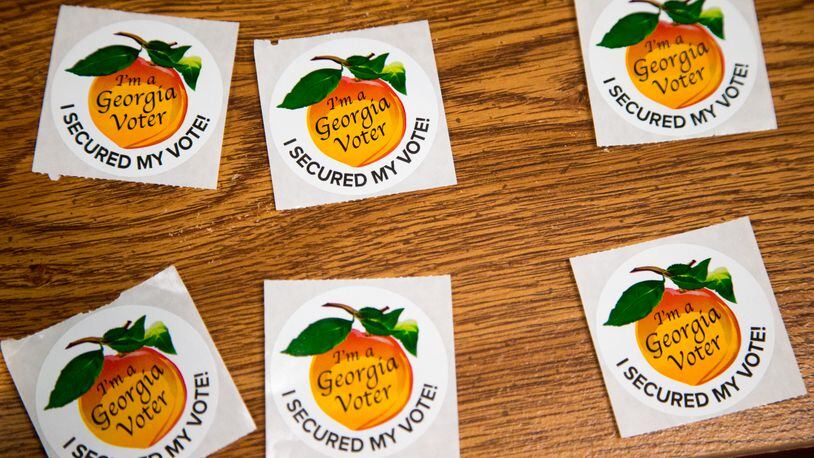 Stickers are ready to hand out as voters cast their ballots in 2020. PHIL SKINNER FOR THE ATANTA JOURNAL-CONSTITUTION