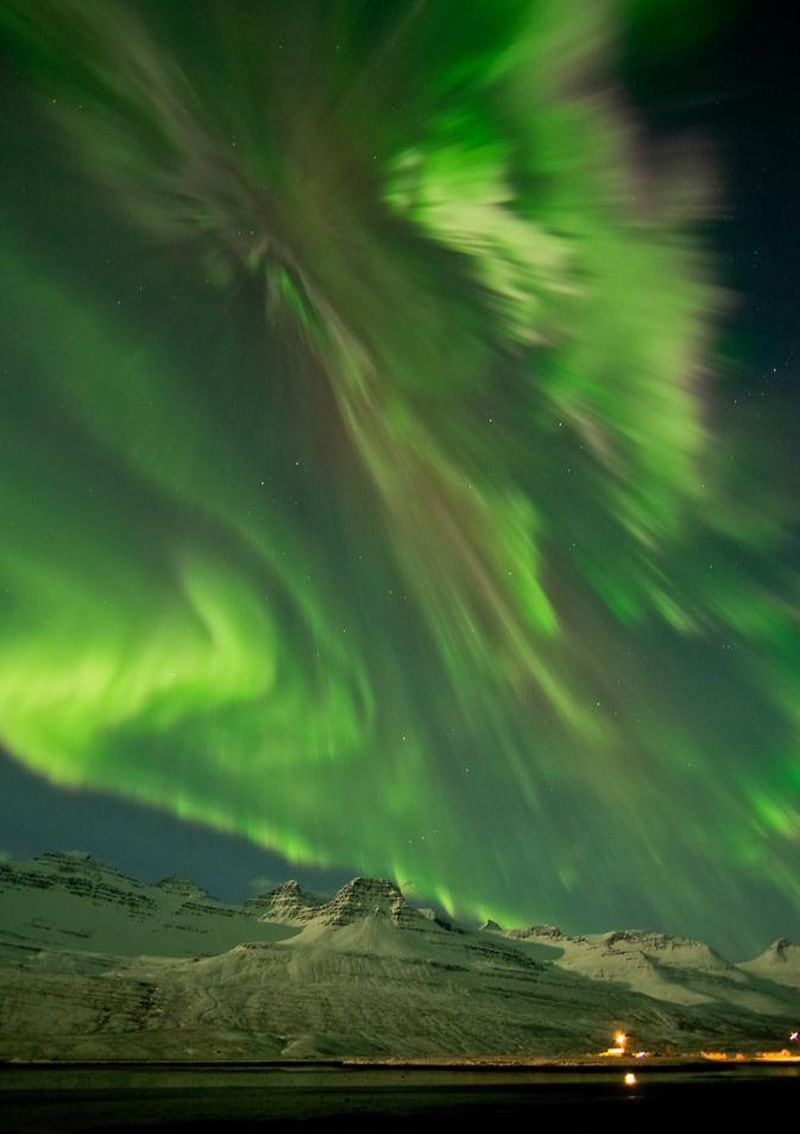 An aurora on March 8, 2012 shimmering over snow-covered mountains in Faskrudsfjordur, Iceland. 