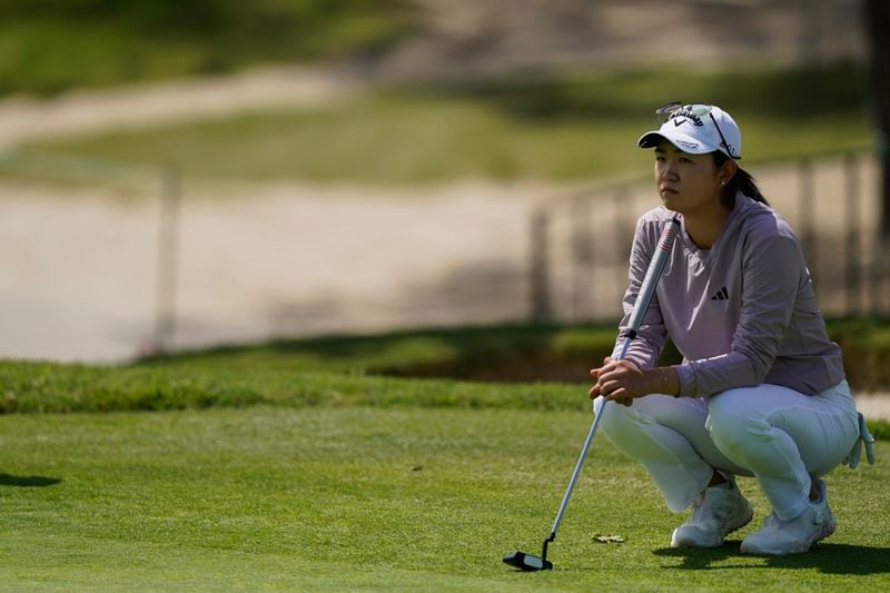 Rose Zhang waits to putt on the fourth green during the first round of the LPGA's JM Eagle LA Championship golf tournament at Wilshire Country Club, Thursday, April 25, 2024, in Los Angeles. (AP Photo/Ryan Sun)
