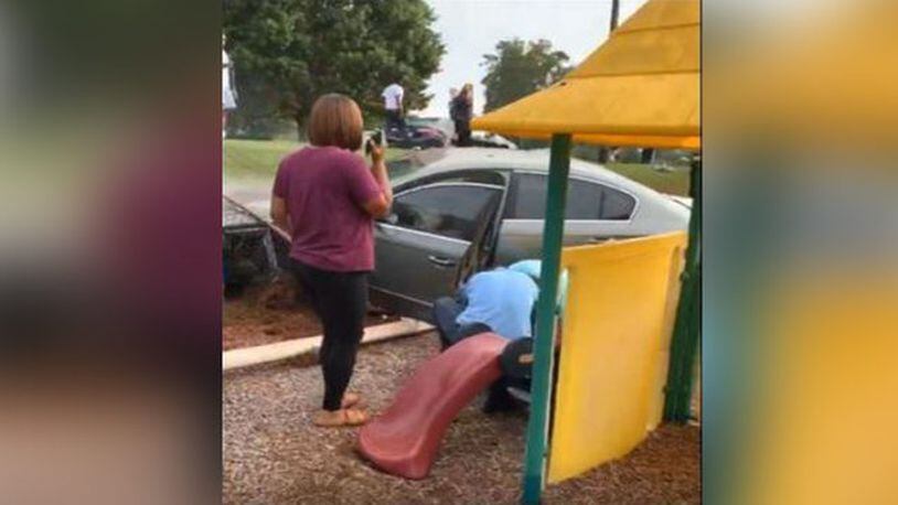 Car flips into daycare playground as children play, bystanders say.