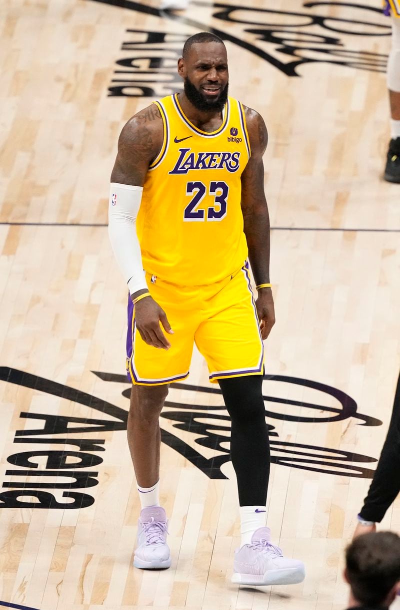Los Angeles Lakers forward LeBron James (23) reacts as he walks back to the bench for a time out against the Denver Nuggets during the second half in Game 2 of an NBA basketball first-round playoff series Monday, April 22, 2024, in Denver. (AP Photo/Jack Dempsey)