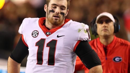 Georgia quarterback Jake Fromm stands on the sidelines in the final minutes of a 40-17 loss to Auburn in a NCAA college football game at Jordan-Hare Stadium on Saturday, November 11, 2017, in Auburn.    Curtis Compton/ccompton@ajc.com