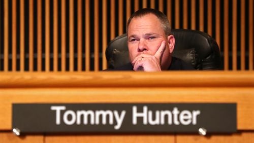 Tommy Hunter, the District 3 leader who recently called U.S. Rep. John Lewis a racist pig on Facebook, listens during a Gwinnett County Board of Commissioners public hearing on Feb. 28, 2017, in Lawrenceville. (Curtis Compton/ccompton@ajc.com)