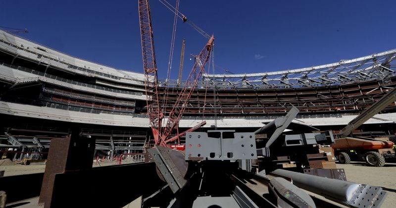 A large crane looms over LA Stadium on Tuesday, Sept. 18, 2018, in Inglewood, Calif. The new facility for the Los Angeles Rams, and Los Angeles Chargers is tentatively scheduled to be competed for the 2020 NFL football season. (AP Photo/Chris Carlson)(Photo: The Associated Press)