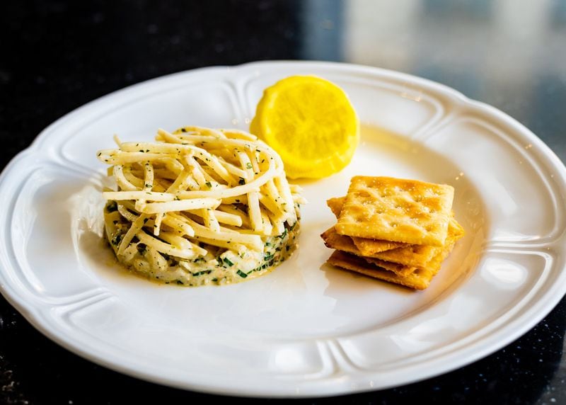 An appetizer of blue crab comes with house-made saltines at By George. CONTRIBUTED BY HENRI HOLLIS