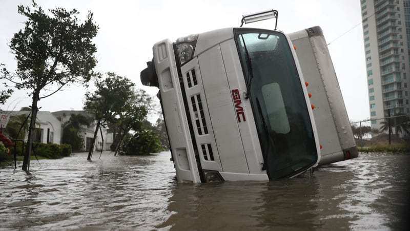 MIAMI, FL - SEPTEMBER 10:  A truck is seen on its side after being blown over as Hurricane Irma passed through on September 10, 2017 in Miami, Florida. Hurricane Irma, which first made landfall in the Florida Keys as a Category 4 storm on Sunday, has weakened to a Category 2 as it moves up the coast.