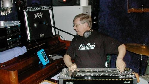 Wade Medlock’s voice opened many Atlantans’ days for years as a reporter and news manager for WGST Radio. Medlock also loved to play music from his youth through his retirement, including founding a country music jam session in 2004.Courtesy of the family