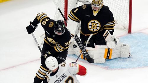 Florida Panthers' Gustav Forsling (42) scores the go-ahead goal against Boston Bruins' Jeremy Swayman (1) as Bruins' Parker Wotherspoon (29) defends during the third period in Game 6 of an NHL hockey Stanley Cup second-round playoff series, Friday, May 17, 2024, in Boston. (AP Photo/Michael Dwyer)