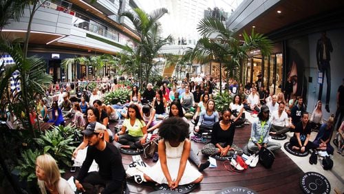 Hundreds gathered earlier this year for a group meditation at Brickell City Centre to celebrate Earth Day. Interest in meditation has increased in light of scientific research that supports claims of its healthy benefits. CONTRIBUTED BY Roberto Koltun/Miami Herald/TNS