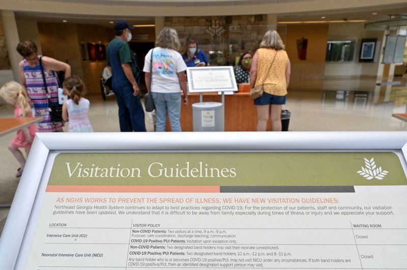 Updated visitation guidelines are displayed at North Patient Tower of Northeast Georgia Medical Center in Gainesville. (Hyosub Shin / Hyosub.Shin@ajc.com)