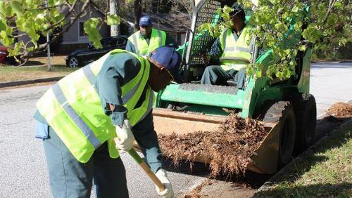 Since March 11, DeKalb County employees are on the roads most Saturdays to “bump curbs,” hard work that includes shovels and skid-steer loaders, clearing curbs of debris.