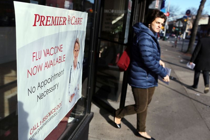 NEW YORK, NY - JANUARY 10: A woman walks out of the Premier Care walk-in health clinic which administers flu shots on January 10, 2013 in New York City. The Flu season has hit parts of the country particularly hard this year with Boston declaring a public health emergency and a Pennsylvania hospital constructing a tent to handle excess flu cases.According to the Centers for Disease Control and Prevention 22,048 flu cases  have been reported from September 30 through the end of 2012.
(Photo by Spencer Platt/Getty Images)