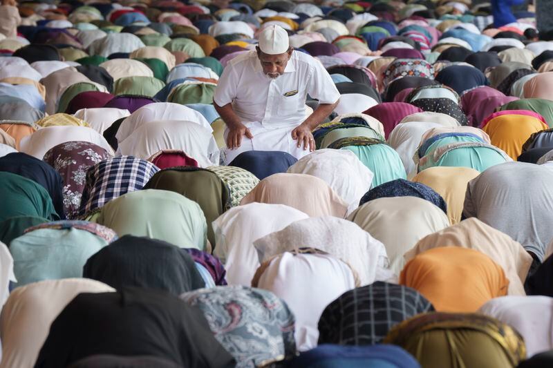 Muslims offer prayers at National Mosque for the Eid al-Fitr, marking the end the holy fasting month of Ramadan in Kuala Lumpur, Malaysia, Wednesday, April 10, 2024. (AP Photo/Vincent Thian)