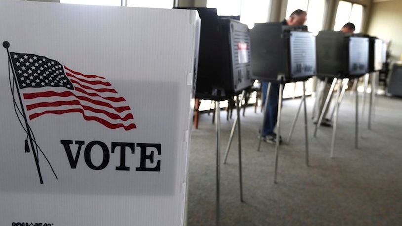 Around 1 in 5 voters nationwide report themselves as undecided or flirting with third-party candidates, with the exact share depending on the poll and how the question is asked. (AP Photo/M. Spencer Green, File)