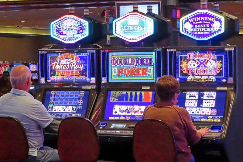 Gamblers play slot machines at Harrah's casino in Atlantic City N.J., on Sept. 29, 2023. Figures released, Tuesday, April 16, 2024, show Atlantic City's casinos, their online partners and horse tracks that take sports bets won over $526 million in March, a month in which New Jersey's internet gambling market set yet another monthly record at $197 million. (AP Photo/Wayne Parry)