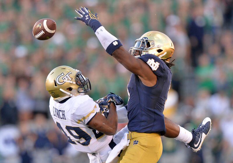 September 19, 2015 South Bend, Indiana - Georgia Tech Yellow Jackets running back Clinton Lynch (49) collides with Notre Dame Fighting Irish linebacker Jaylon Smith (9) as he attempts to catch a ball in the second half at Notre Dame Stadium in South Bend, Indiana on Saturday, September 19, 2015. Georgia Tech Yellow Jackets lost the game 30-22. HYOSUB SHIN / HSHIN@AJC.COM