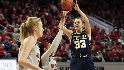 Georgia Tech guard Francesca Pan (33) shoots against North Carolina State guard Jakia Brown-Turner (11) and center Elissa Cunane during the first half Sunday, Feb. 16, 2020,  in Raleigh, N.C.