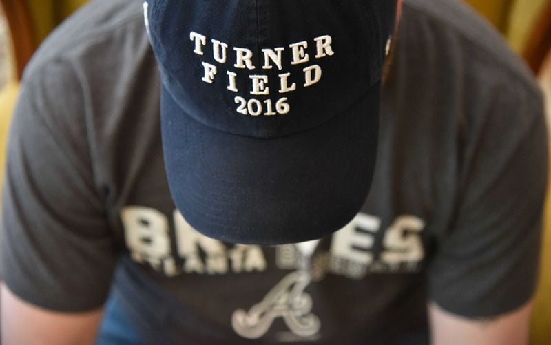 Justin Green, disgruntled Braves fan, shows his "Turner Field 2016" hat at his home Thursday.