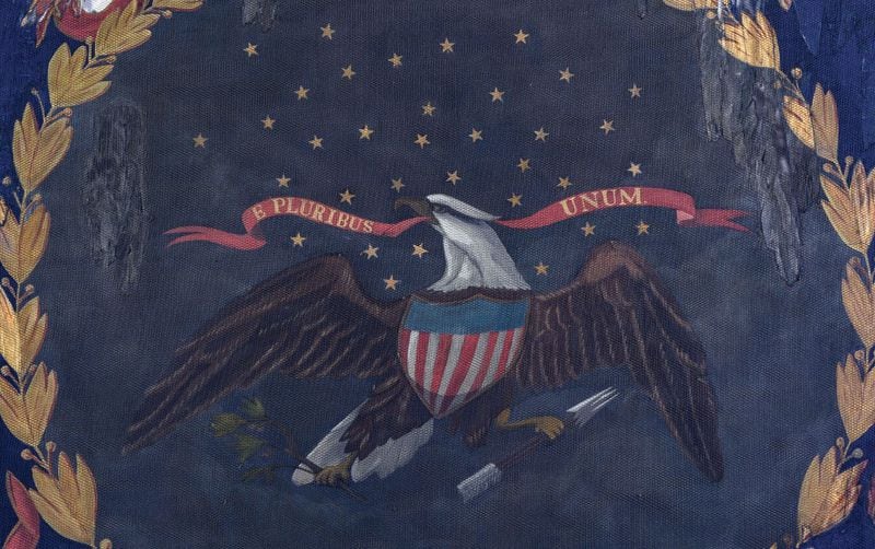 A detail of the battle flag from the 127th Regiment of the U.S.  Colored Troops shows some of the repair work done by conservators, along with the motto "E Pluribus Unum." CONTRIBUTED: MORPHY AUCTIONS