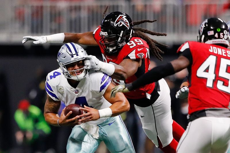 Dallas Cowboys quarterback Dak Prescott is sacked by Adrian Clayborn of the Falcons during the first half of Sunday’s game. Clayborn had six of the Falcons’ eight sacks.