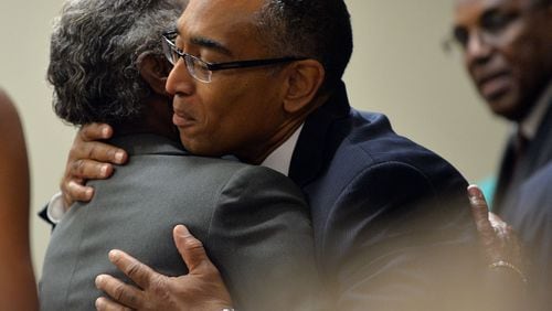 Suspended Dekalb County CEO Burrell Ellis hugs a supporter before he appears before Judge Courtney L. Johnson in Dekalb County Superior Court during opening arguments in his trial Tuesday, September 16, 2014.