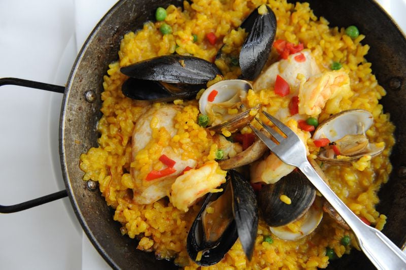 Paella with saffron calasparra rice, mussels, chicken, sausage, clams and prawns at Babette.  (BECKY STEIN)