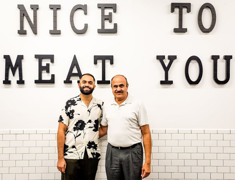 Chef Farhan Momin, known for “MasterChef” among other things, is with his father, Ahmed, at Atlanta Halal Meat & Food, which the family owns. CONTRIBUTED BY HENRI HOLLIS