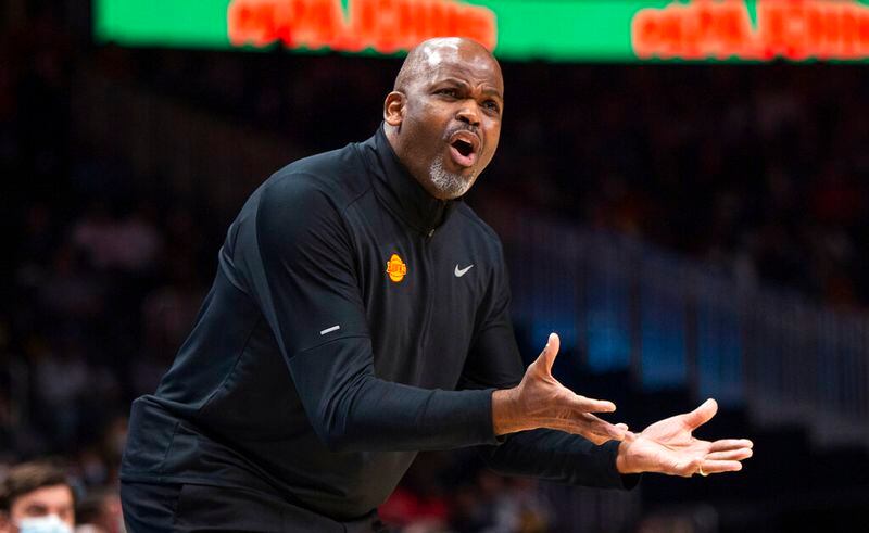 Atlanta Hawks coach Nate McMillan reacts during the first half of the team's NBA basketball game against the Minnesota Timberwolves on Wednesday, Jan. 19, 2022, in Atlanta. (AP Photo/Hakim Wright Sr.)