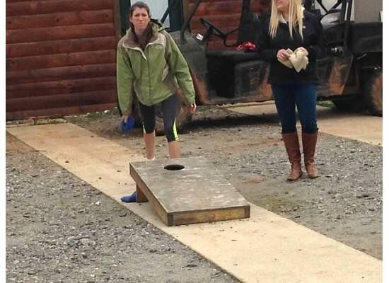 Playing corn hole before zip lining in north Georgia