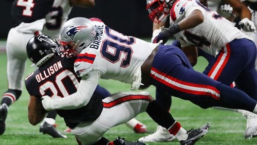 111821 Atlanta: Falcons running back Qadree Ollison is leveled at the line of scrimmage by Patriots defensive lineman Christian Barmore during the second half in a NFL football game on Thursday, Nov. 18, 2021, in Atlanta.    “Curtis Compton / Curtis.Compton@ajc.com”