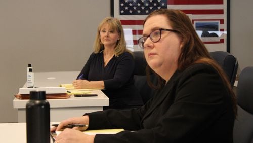 Cobb County Commission candidate Alicia Adams (left) watches as her attorney argues against her disqualification in a hearing over the residency challenge brought by Mindy Seger (right) on Friday, March 15, 2024 in Marietta. Adams is appealing her disqualification to the Cobb Superior Court. (Taylor Croft/taylor.croft@ajc.com)