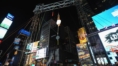 Magician Criss Angel performs his upside-down double straight jacket escape stunt in the middle of Times Square in 2009. It's the same stunt that landed him in the hospital on Friday