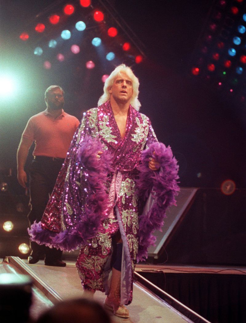 With WCW wrestler Ric Flair, shown in 1989, it could be hard to tell where the line was between his on-camera persona and the real man behind him. AJC FILE PHOTO
