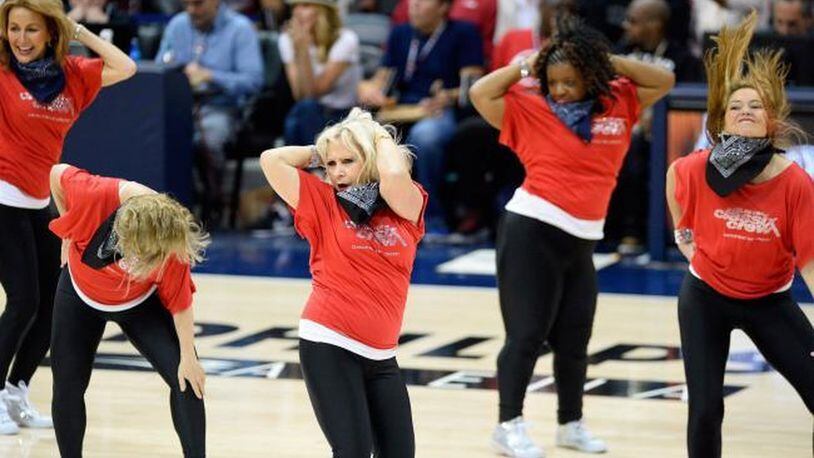 Members of the Silver Classix Crew, Connie Korb, Marci Nunnery (head down), Dinah Farrell, Wendy C. Waddell and Margaret Snider, put on a halftime show during an Atlanta Hawks game. The women are all over 50. DAVID TULIS / UPI