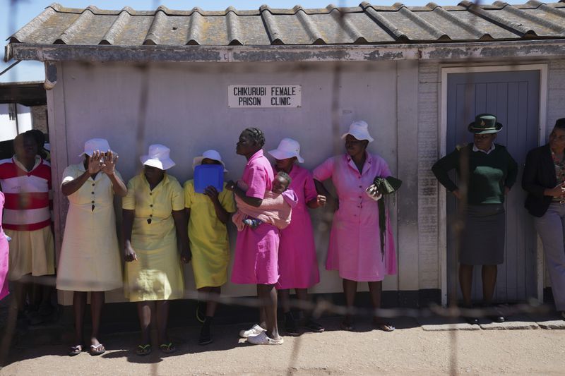Female prisoners line up inside Chikurubi female prison on the outskirts of the capital Harare, Thursday, April 18, 2024. Zimbabwe President Emmerson Mnangagwa has granted amnesty to more than 4,000 prisoners in an independence day amnesty. The amnesty coincided with the country's 44th anniversary of independence from white minority rule on Thursday and included some prisoners who were on death row. (AP Photo/Tsvangirayi Mukwazhi)