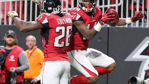 Falcons wide receiver Justin Hardy celebrates his touchdown catch with running back Tevin Coleman to take a 17-7 lead over the Cowboys during the third quarter in a NFL football game on Sunday, November 12, 2017, in Atlanta.    Curtis Compton/ccompton@ajc.com