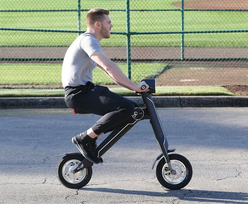 Feb 16, 2018 Lake Buena Vista: Atlanta Braves first baseman Freddie Freeman reports early for spring training arriving on a scooter on Friday, Feb 16, 2018, at the ESPN Wide World of Sports Complex in Lake Buena Vista.     Curtis Compton/ccompton@ajc.com