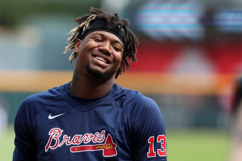 Atlanta Braves right fielder Ronald Acuna Jr. talks with teammates before their game against the Los Angeles Dodgers at Truist Park, Tuesday, May 23, 2023, in Atlanta.  (Jason Getz / Jason.Getz@ajc.com)