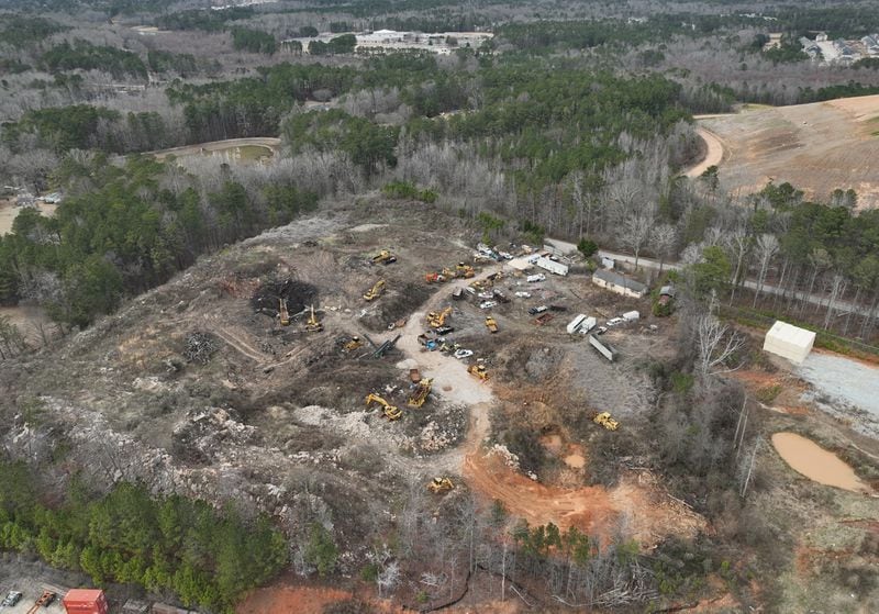 Aerial photo shows an illegal landfill that has been a nuisance in this community for years and where waste is periodically burned, raising concerns about air pollution levels, Friday, Feb. 10, 2023, in Fairburn. For years, former City of South Fulton Councilwoman Naeema Gilyard and other neighbors have been concerned about breathing smoke from the landfill, not to mention emissions from the steady stream of diesel big rigs that coming and going from warehouses that line South Fulton Parkway. Even with modern engines and cleaner fuel, exhaust from diesel trucks is known to contain a dangerous cocktail of air pollutants. (Hyosub Shin / Hyosub.Shin@ajc.com)