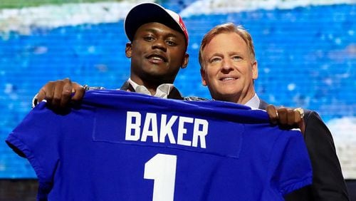 Deandre Baker of Georgia poses with NFL Commissioner Roger Goodell after being chosen No. 30 overall by the New York Giants during the first round of the 2019 NFL Draft on April 25, 2019 in Nashville, Tennessee. (Photo by Andy Lyons/Getty Images)