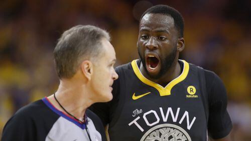 Golden State Warriors'  Draymond Green complains to Mike Callahan during Game Two of the Western Conference Semifinals against the New Orleans Pelicans at ORACLE Arena on May 1, 2018, in Oakland.