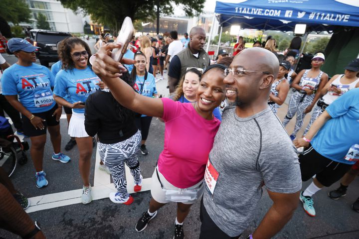 Senator Raphael Warnock pauses for a photo before the 53rd running of the Atlanta Journal-Constitution Peachtree Road Race in Atlanta on Sunday, July 3, 2022. (Miguel Martinez / Miguel.Martinezjimenez@ajc.com)