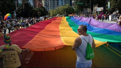 The 2018 edition of the annual parade at Atlanta Pride  makes its way down Peachtree Street .