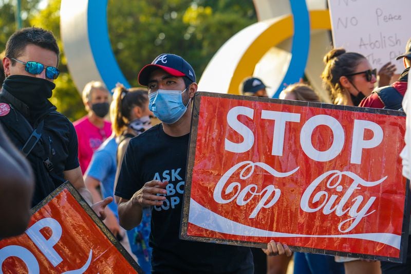 Protesters march through downtown Atlanta to the World of Coca-Cola on Friday, Sept 3, 2021 to demonstrate against the police training facility.
(Jenni Girtman for The Atlanta Journal-Constitution)
