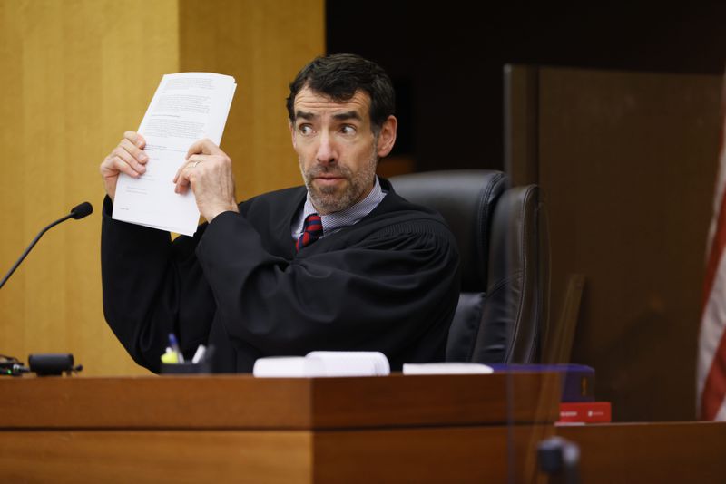 Fulton County Superior Court Judge Robert McBurney reacts to arguments by D.A. Fani Willis during a Jan. 24, 2023 hearing over whether to release the final report of a special grand jury. Miguel Martinez / miguel.martinezjimenez@ajc.com